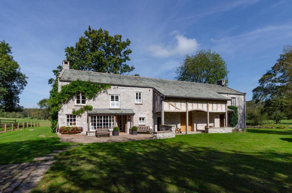 a large white house with a large yard at 3 Bed in Carr Bank oc-gl128 in Beetham