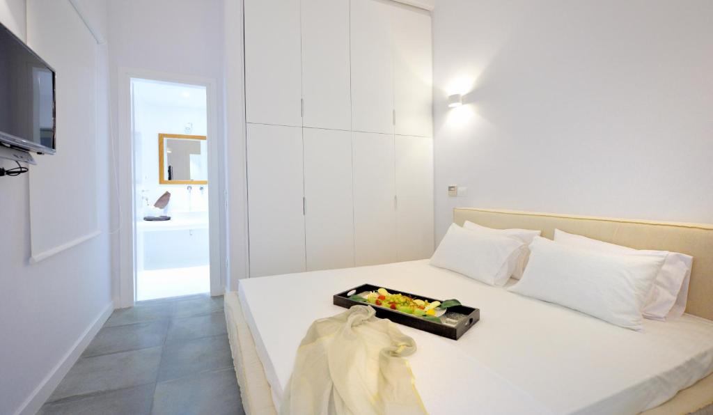 Postel nebo postele na pokoji v ubytování Mykonos Ark Villas