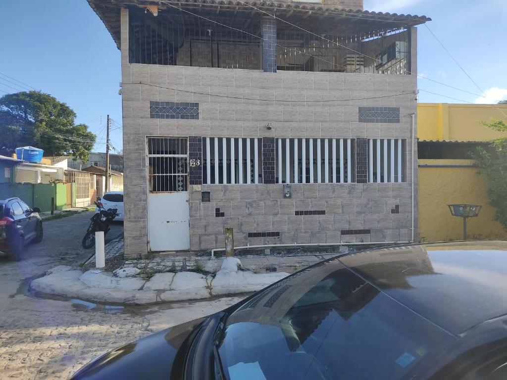 a building is under construction with a car parked in front at FLAT PERTO do centro de convenções e Chevrolet Hall in Recife