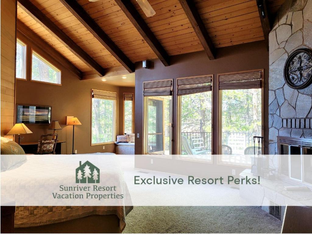 a large living room with a table in a house at 6 Colonial Lane in Sunriver