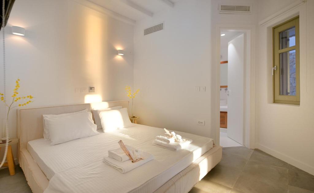 Postel nebo postele na pokoji v ubytování Mykonos Ark Villas