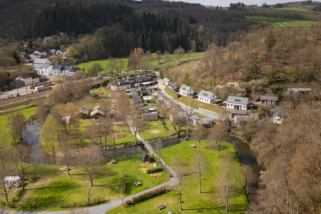 an aerial view of a village with a river and houses at Pod View-side river am clerve in Enscherange