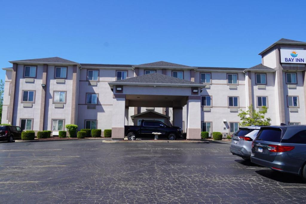 a parking lot in front of a hotel at Bay Inn & Suites Troy in Troy