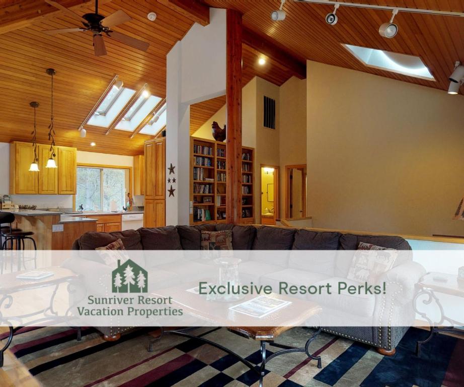 a kitchen and a living room with a table at 6 Summit View Lane in Sunriver
