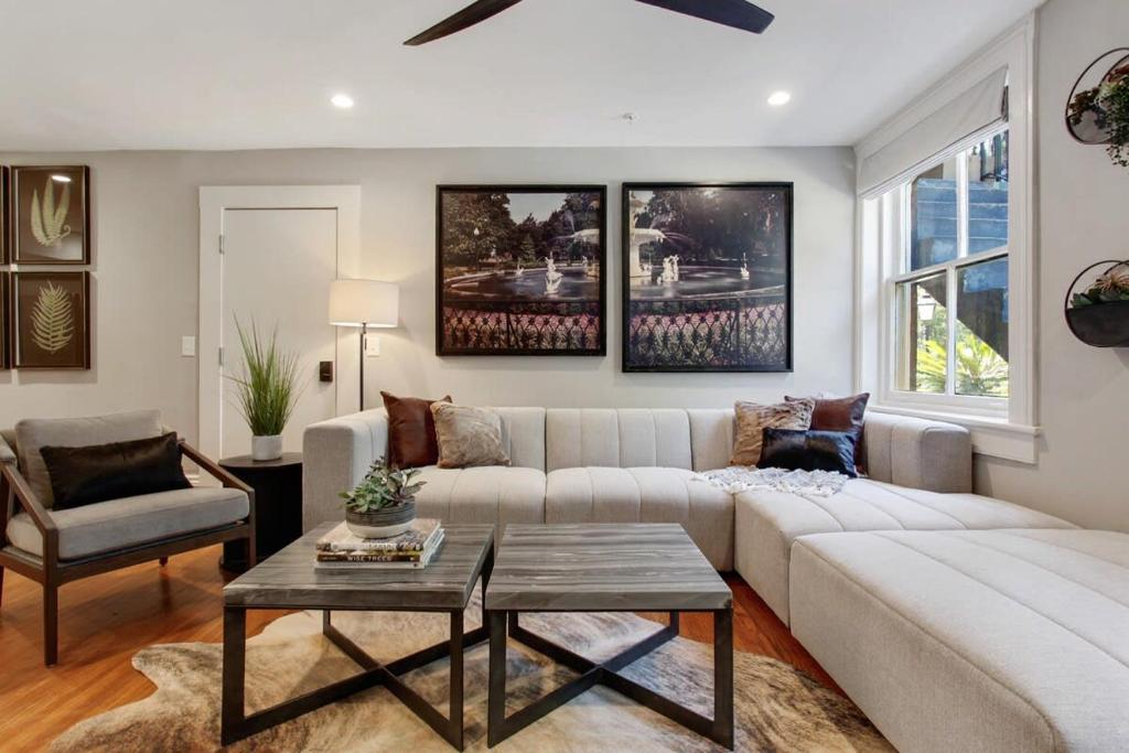 a living room with a couch and a table at Cozy Charming Historic Home in Savannah