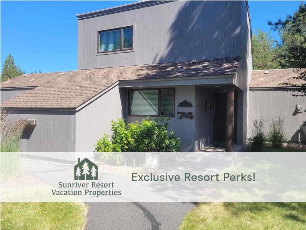 a house with a sign that reads summer resort exclusive resort permits at 74 Meadow House in Sunriver