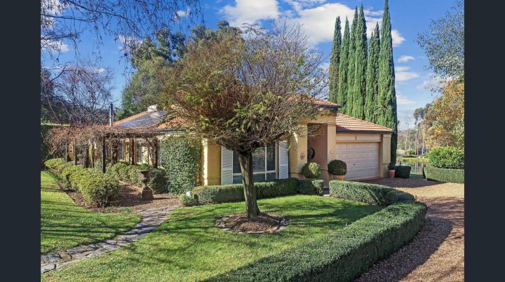 a house with a tree in the front yard at La Dolce Vita in Ancona