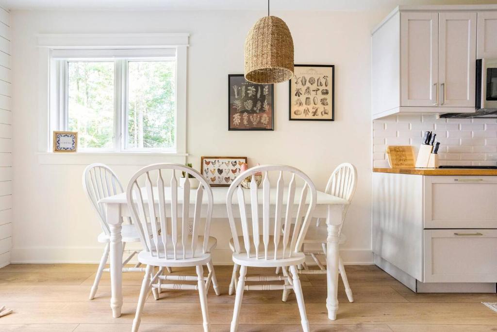 a kitchen with a white table and four chairs at Cozy Country Guest Suite in Zionsville