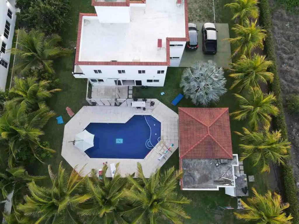 an aerial view of a house with a swimming pool at Casa La Yola in Monterrico