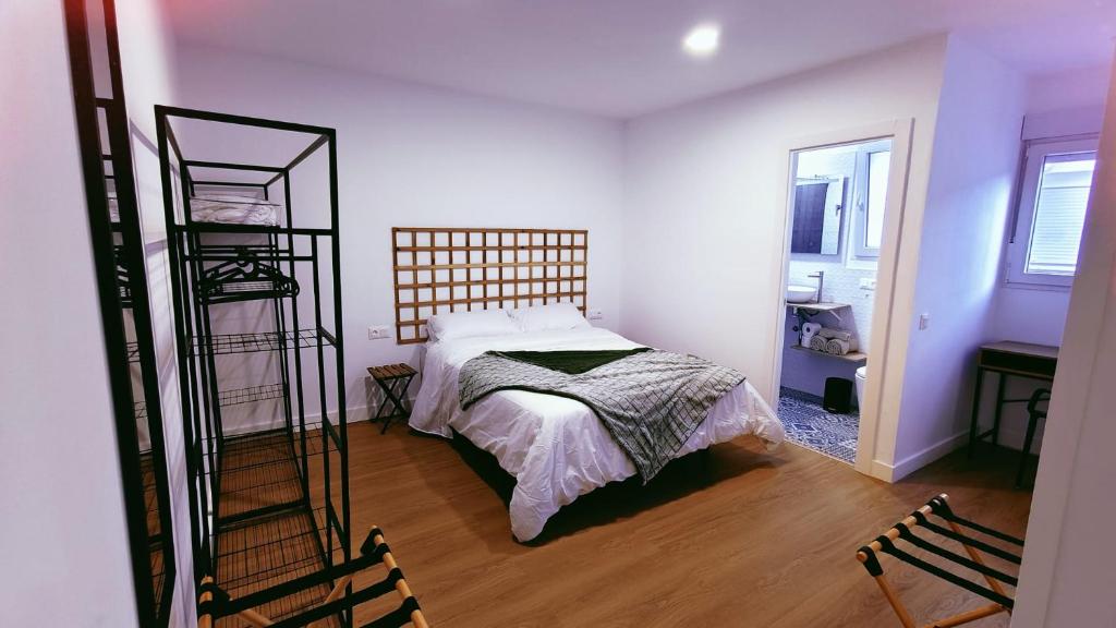a bedroom with a bed and a ladder at HDEZfalcon in Las Lagunas