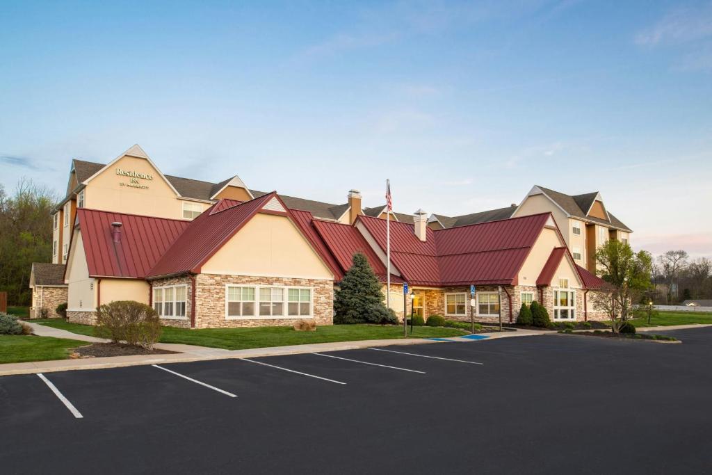 a large building with a red roof at Residence Inn Columbia in Columbia