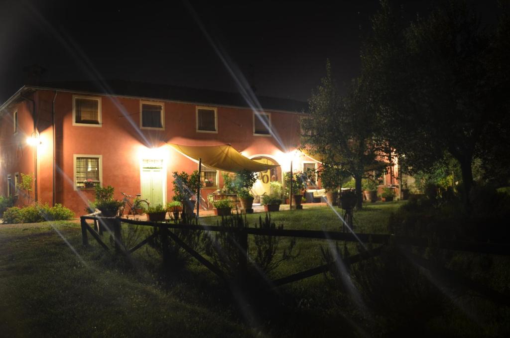 a house at night with lights in the yard at Agriturismo Al Podere Di Rosa in Sant' Alessio