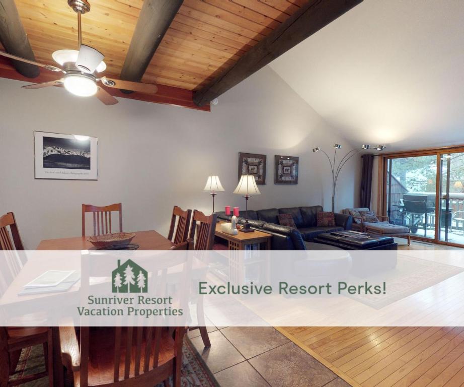 a living room with a table and a couch at 62 Wildflower in Sunriver