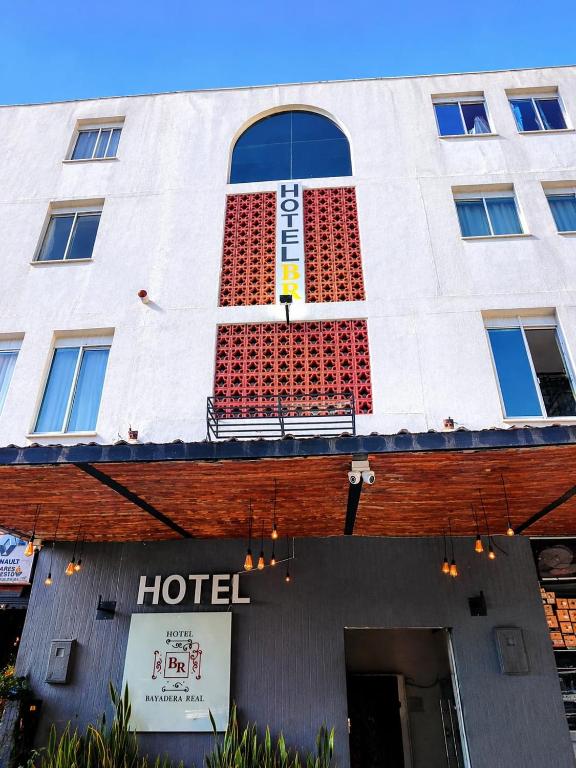 a hotel with a sign on the front of it at Hotel Bayadera Real in Medellín