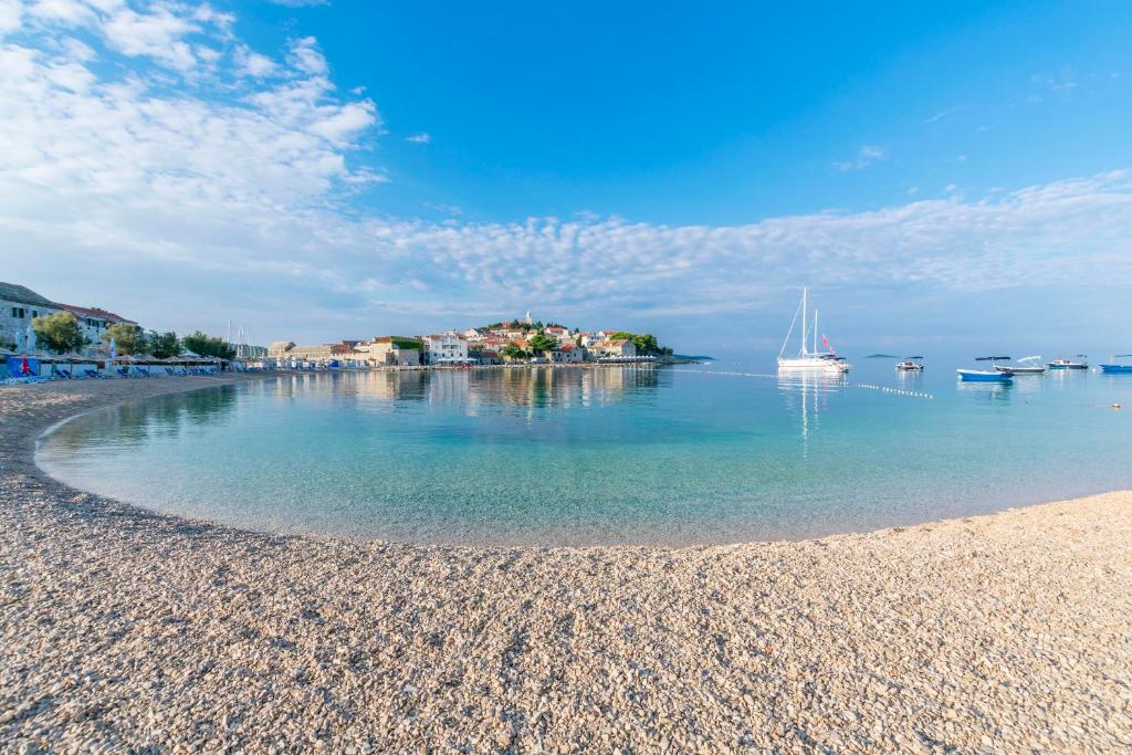 a view of a beach with boats in the water at House Matilda in Primošten