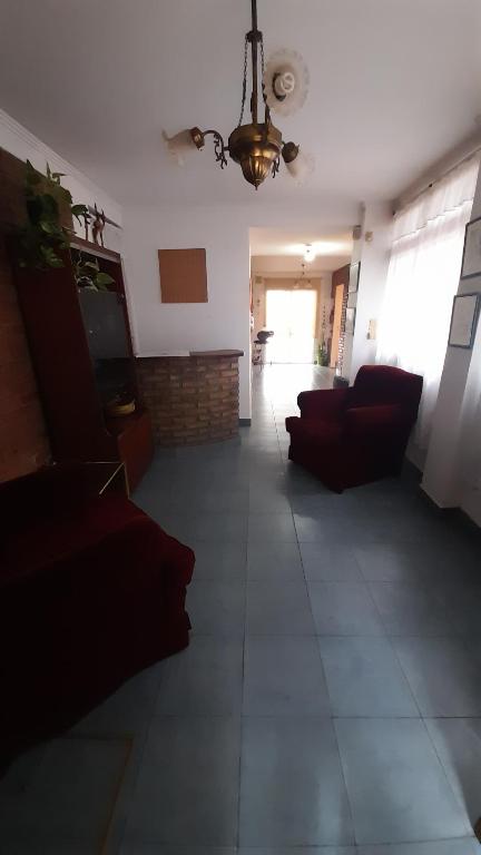 a living room with couches and a ceiling at Casamira in Rosario