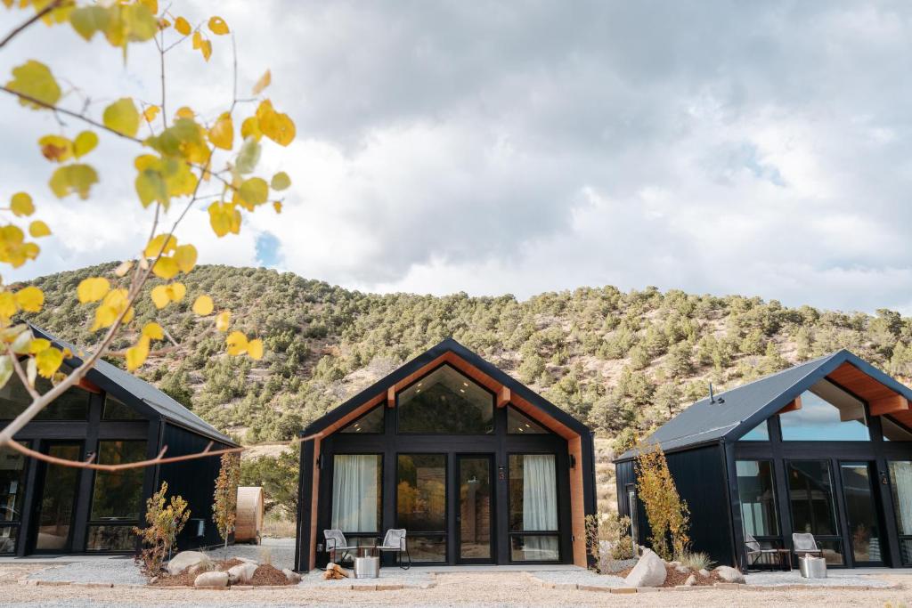 a house with a mountain in the background at Frontcountry Salida in Salida