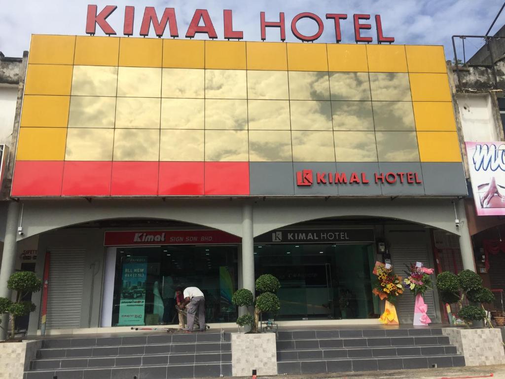 a man standing in front of a hotel at Kimal Hotel Kamunting in Taiping