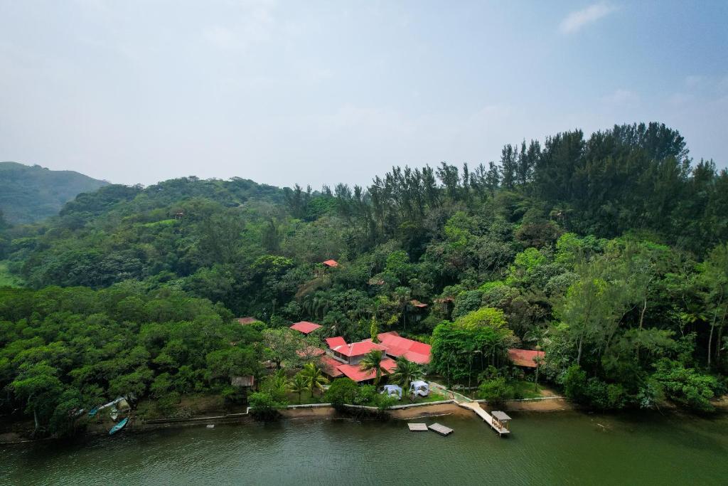 an aerial view of a house in the middle of a river at Los Amigos Ecoturismo y Reserva Natural in Catemaco