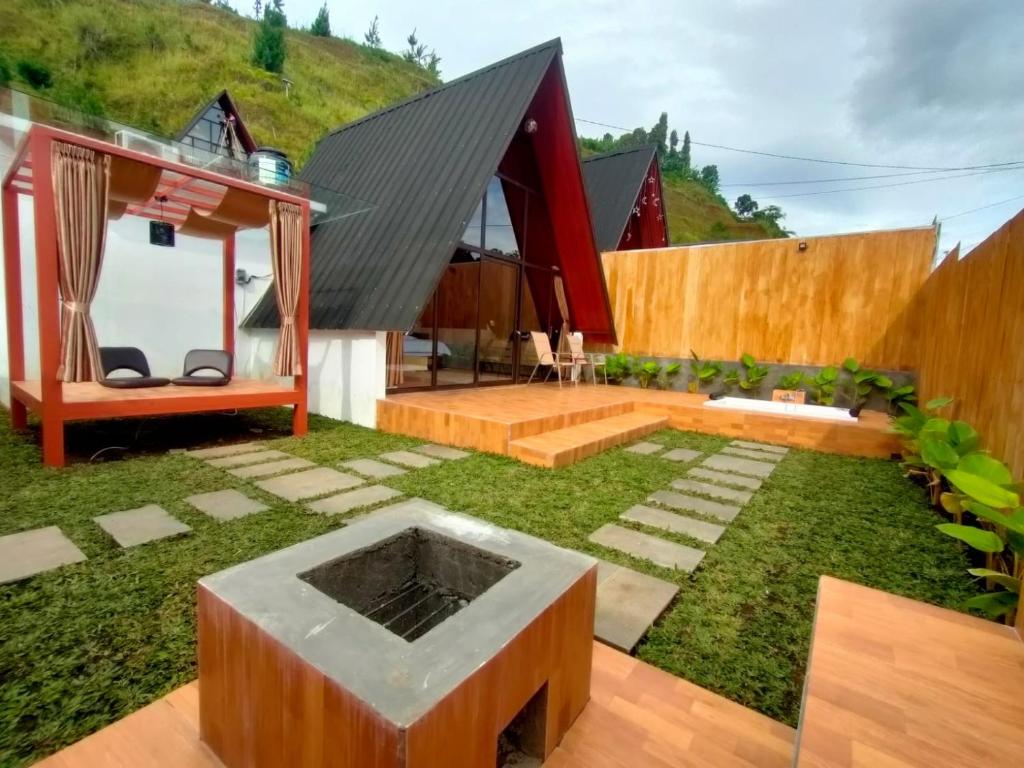 a house on a hill with a garden at Sapphire Private Glamping in Bandung