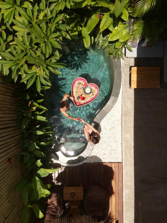 an overhead view of a painting of a heart in the water at Villa Naka - Gili Trawangan - Traditional Villa & Private pool in Gili Trawangan