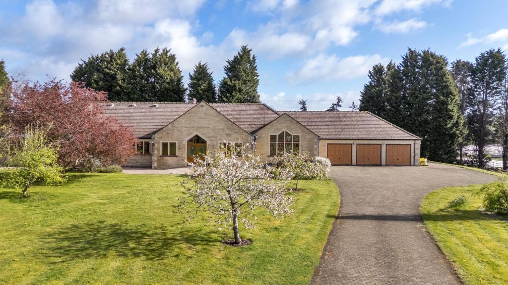 a house with a driveway and a garage at Manor House in Chesterfield