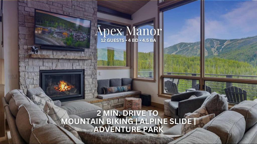 a living room with a couch and a fireplace at Apex Manor in Winter Park