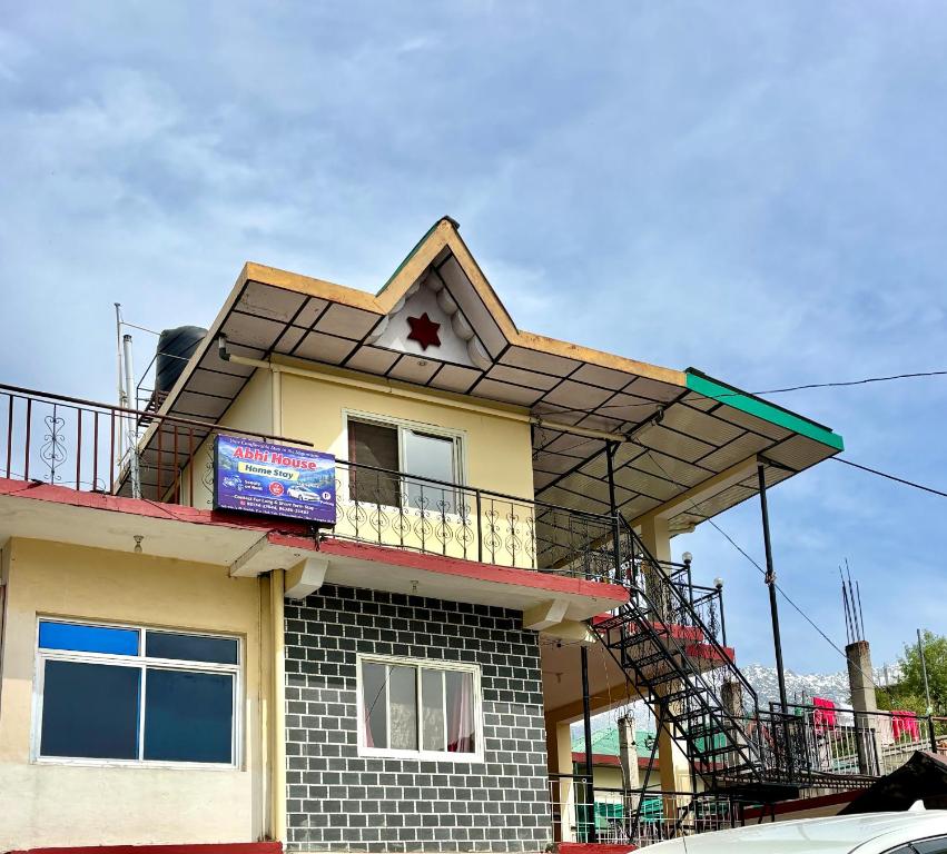 a house with a star on the top of it at Abhi house Naddi in McLeod Ganj