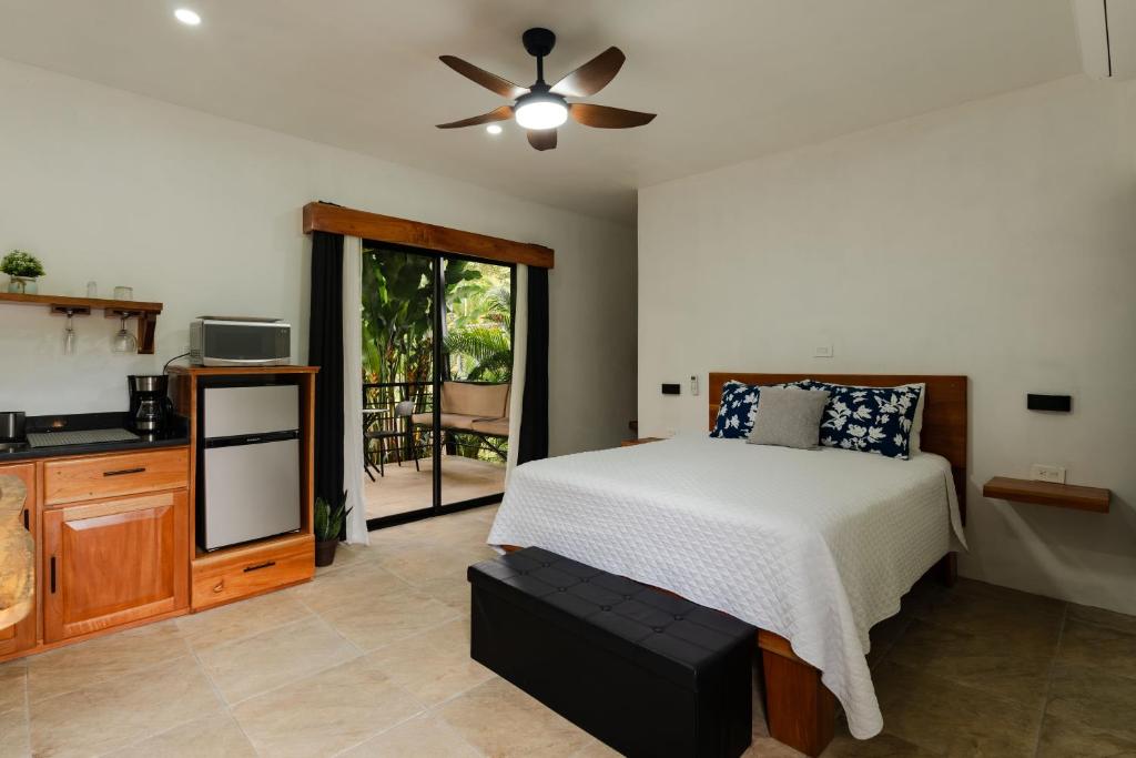 a bedroom with a bed and a ceiling fan at Creekside Lofts #1 in Fortuna