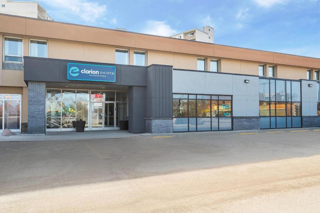 a building with a sign on the front of it at Clarion Pointe in Winnipeg