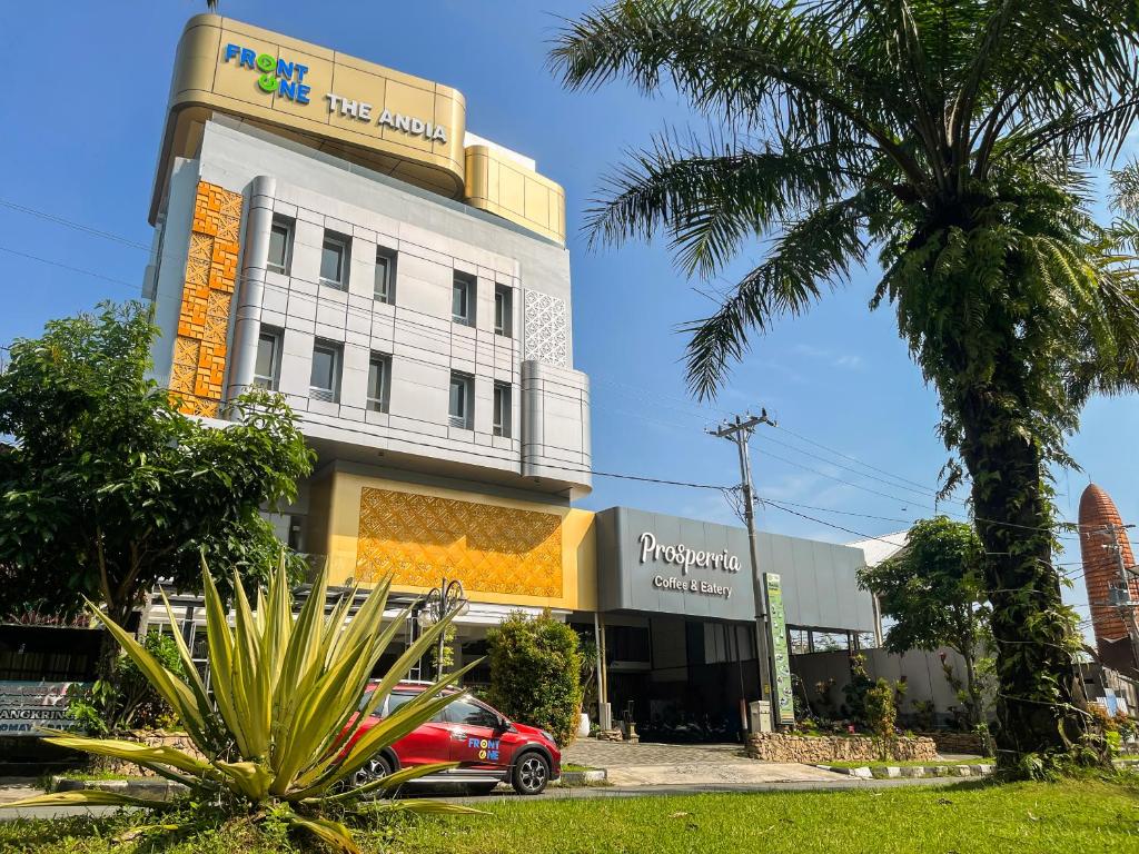 a building with a car parked in front of it at Front One The Andia Boyolali in Boyolali
