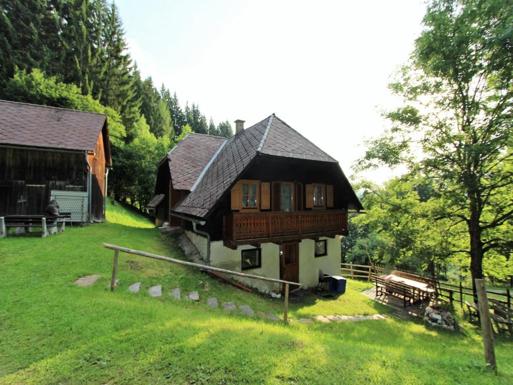 a large wooden house in the middle of a field at Chalet in Prebl nahe Klippitztörl Ski in Prebl