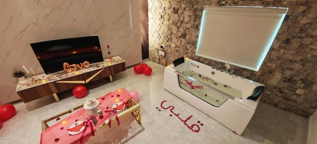 an overhead view of a room with a candy bar at روز بيلا 1 Rosa Bella in Al Jināh