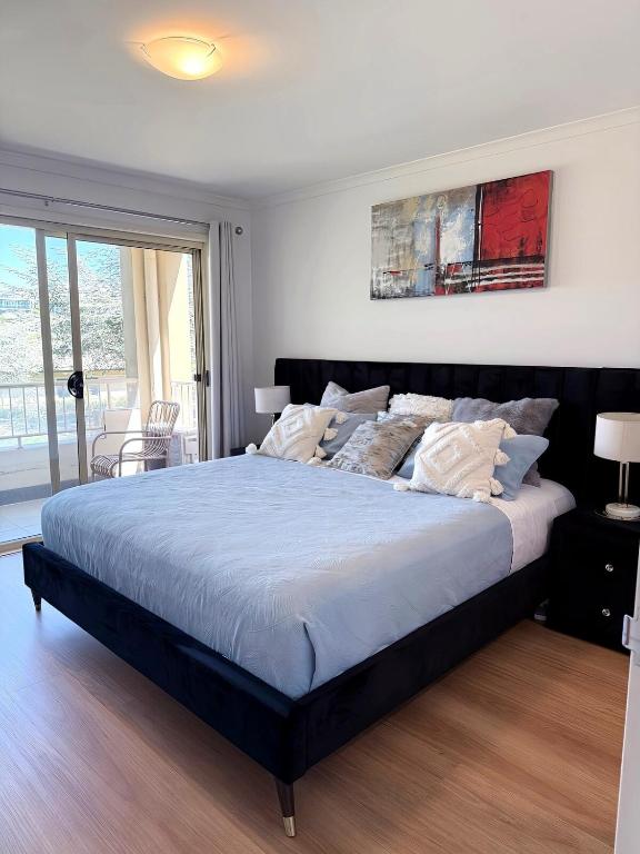 a bedroom with a large bed in a room at Stylish inner-city Haven in Braddon
