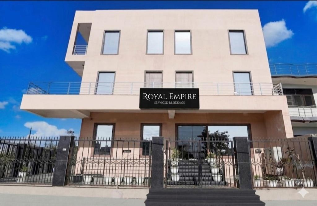 a building with a sign that reads royal entrance at GREAT ROYAL eMPIRE in Tājganj