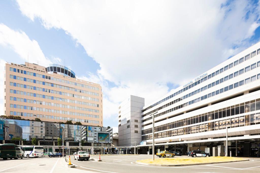 a parking lot in front of a large building at Hotel Clio Court Hakata in Fukuoka