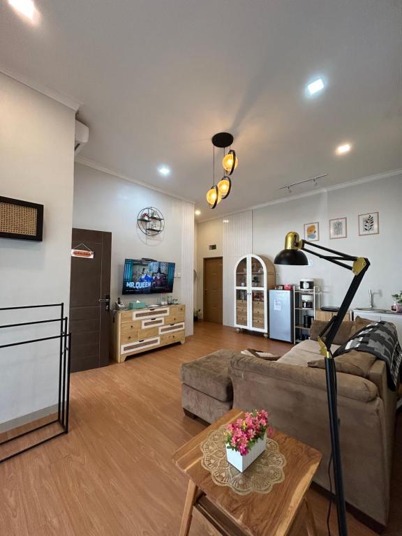 a living room with a couch and a table at Clamitan House Padalarang in Padalarang