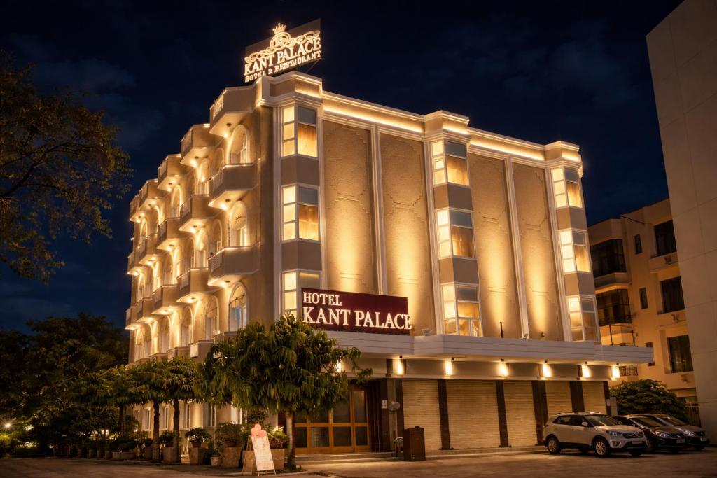a large building with a sign on top of it at Hotel Kant Palace in Tājganj