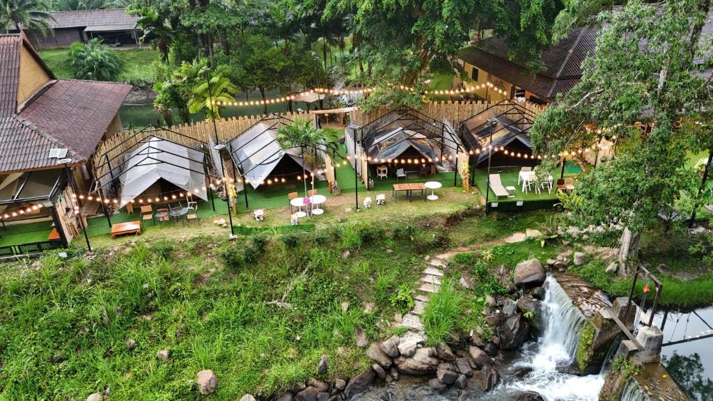 an aerial view of a resort with a waterfall at Le Rafting & Le Camping in Ban Hin Dan