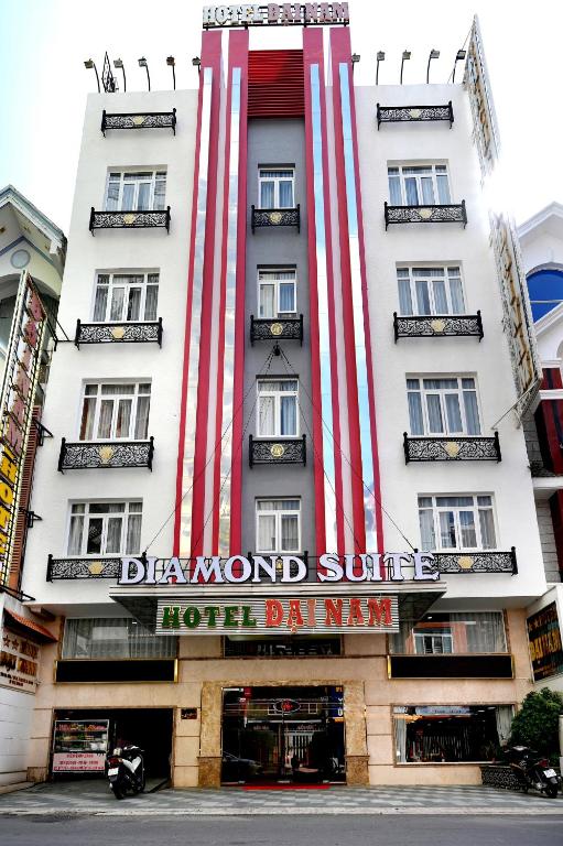 a hotel building with red and white stripes on it at Diamond Suite Dai Nam Hotel in Can Tho