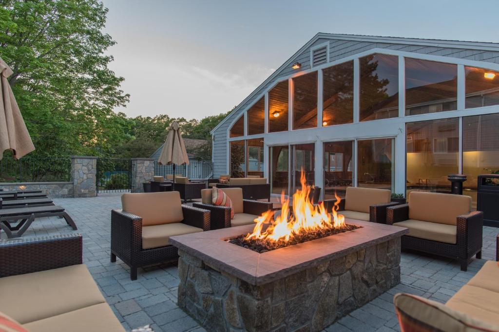 a fire pit in the middle of a patio at Rockport Inn and Suites in Rockport