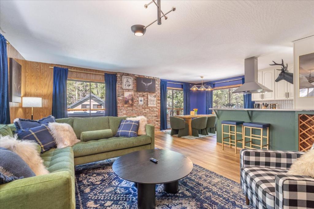 a living room with a couch and a table at Donner Lake Outpost home in Truckee