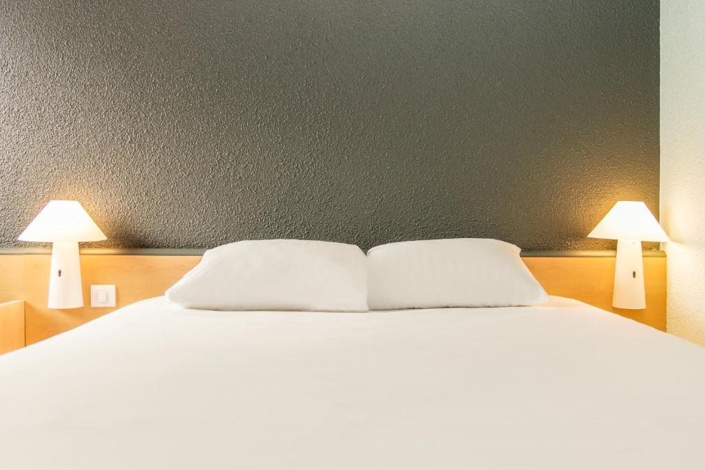 Postel nebo postele na pokoji v ubytování ibis Carcassonne Centre - La Cité