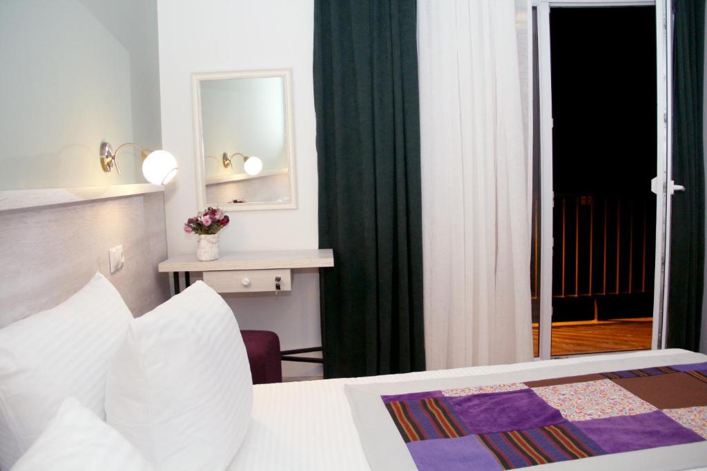 Postel nebo postele na pokoji v ubytování Hotel Delisi