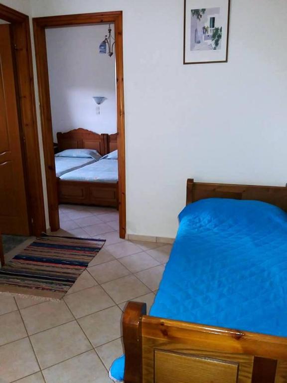 Postel nebo postele na pokoji v ubytování Tiki Rooms