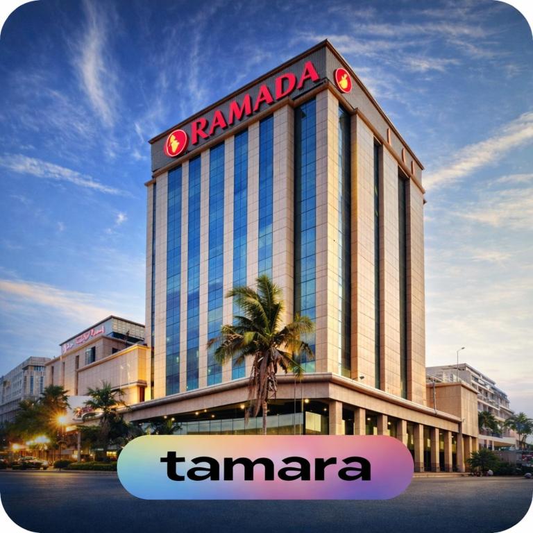 a tall building with a tamara sign on it at Ramada by Wyndham Continental Jeddah in Jeddah