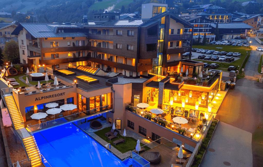 an aerial view of a hotel with a swimming pool at Alpinresort ValSaa - Adults Only in Saalbach-Hinterglemm