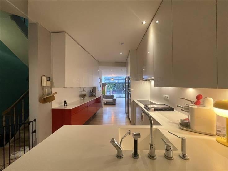 a kitchen with a sink and a counter top at Tomorrowland Boom in Boom