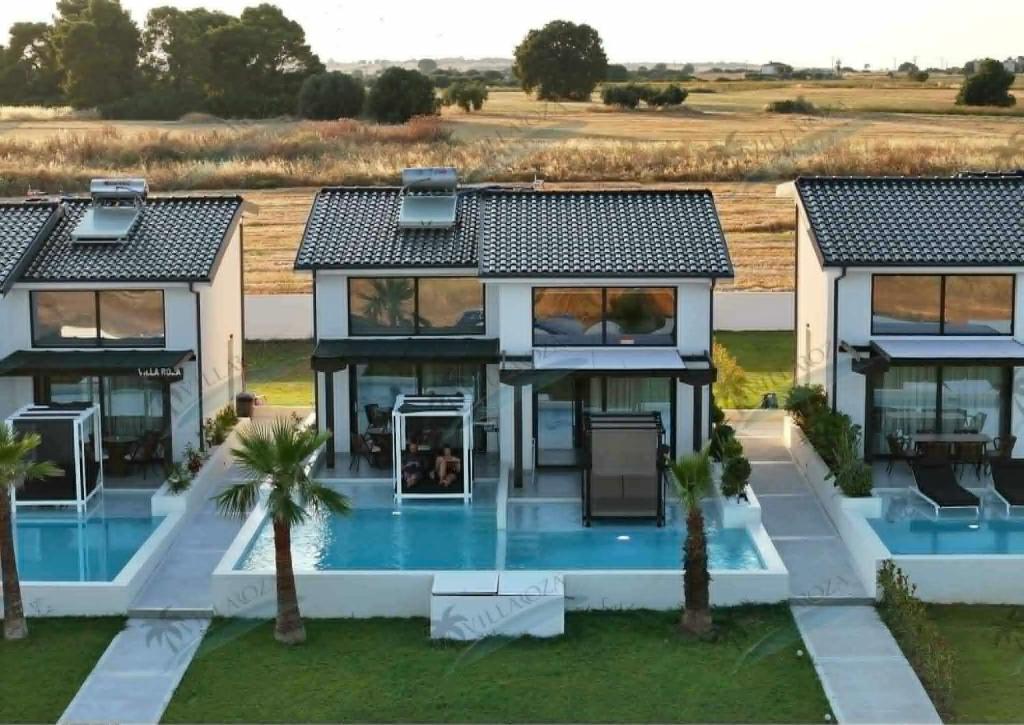 an aerial view of a house with a swimming pool at Villa Roza 2 in Kallithea Halkidikis