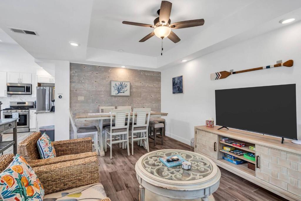 a living room with a flat screen tv at Coffee | Streaming TV | Fast WIFI | Pet Friendly in Seaside Heights
